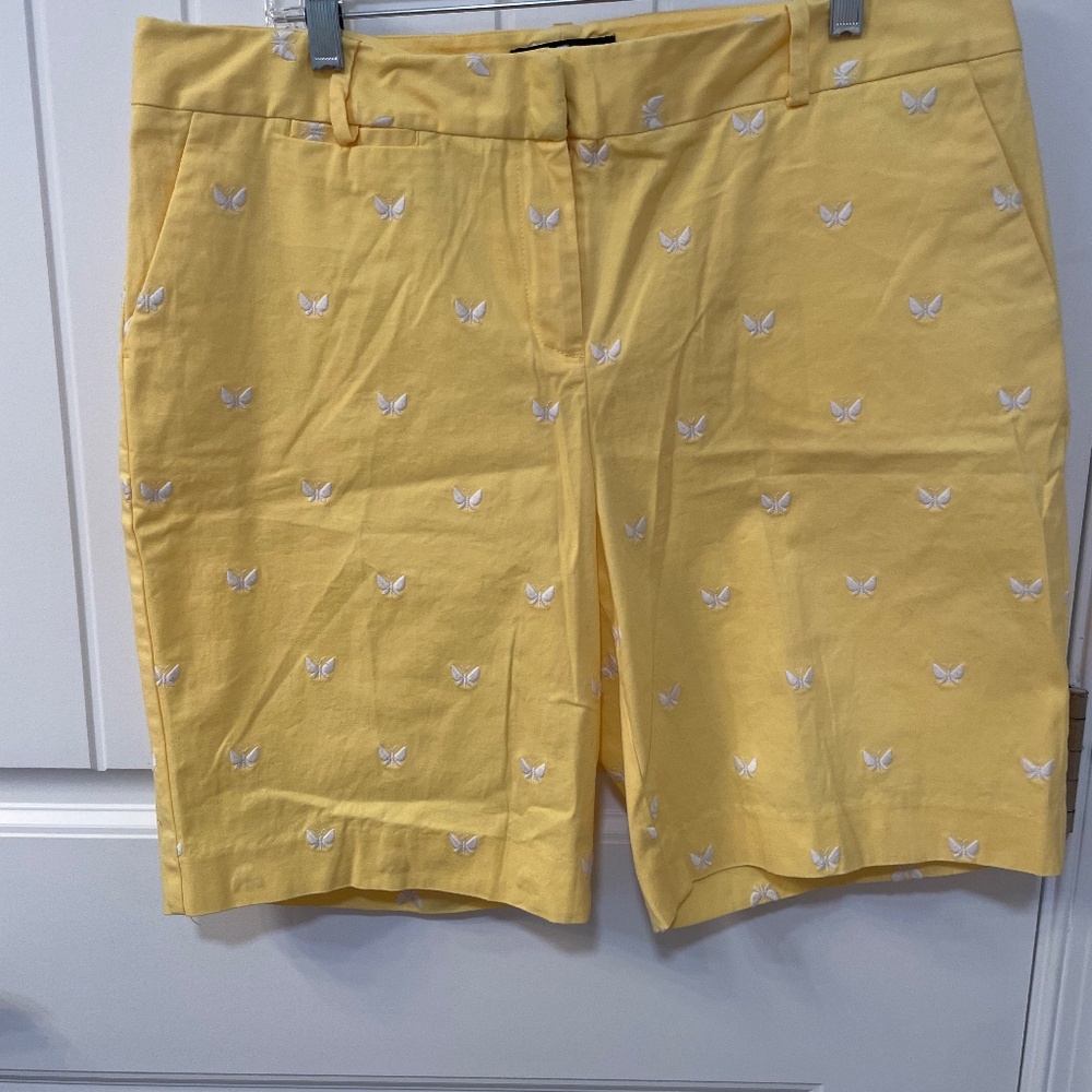 Yellow with white butterflies embroidered on the shorts. Talbots